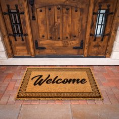 Welcome Mat At Custom Front Door Of House. Welcome Mat At Custom Front Door Of House.